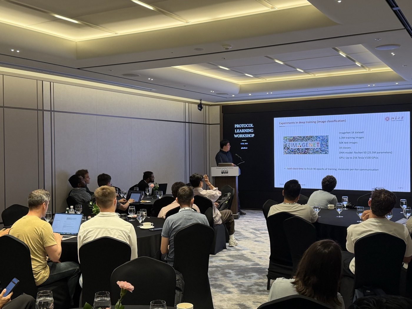 Attendees watching a presentation at the ICML Protocol Learning workshop
