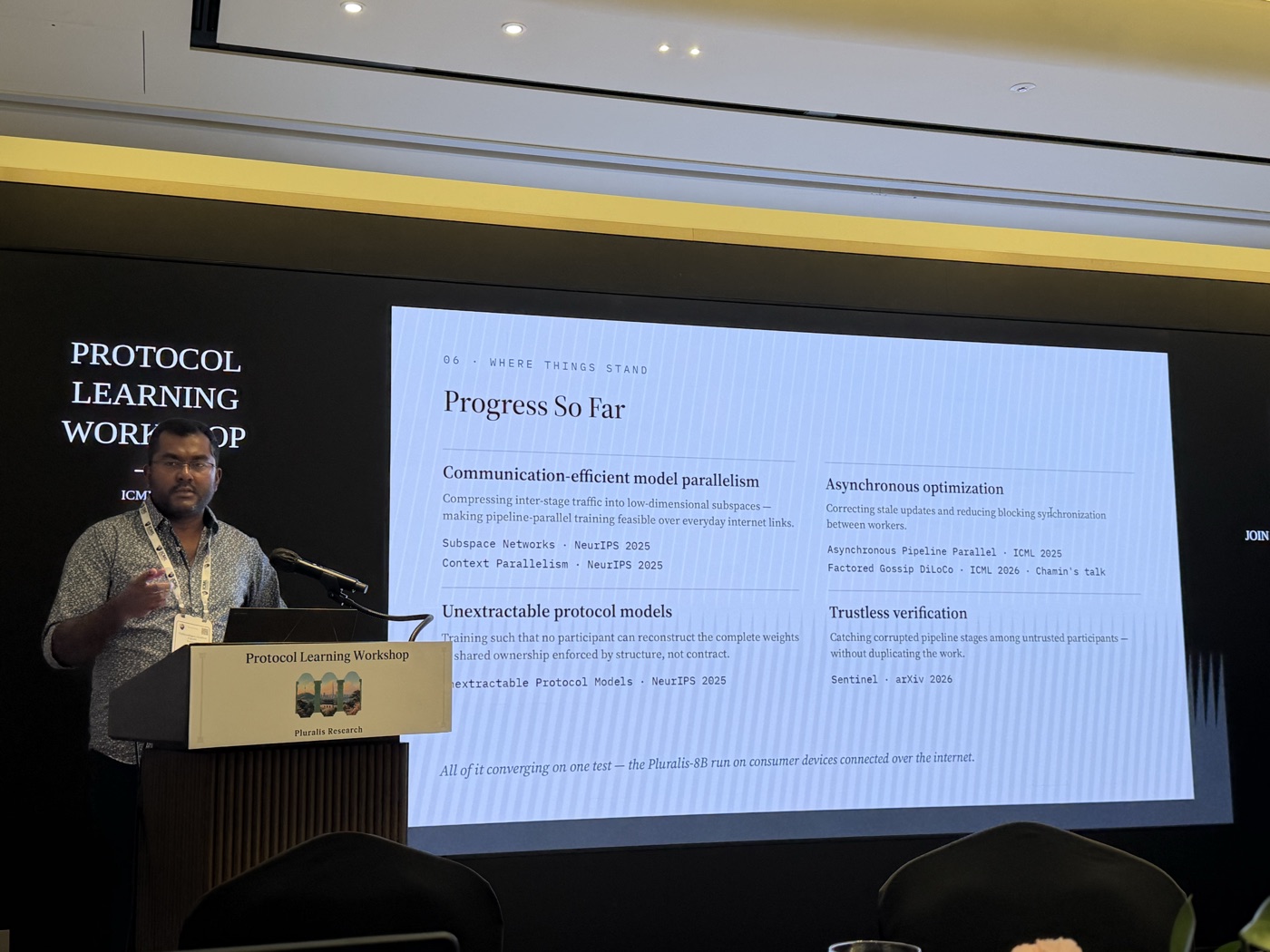 Speaker presenting research at the ICML Protocol Learning workshop