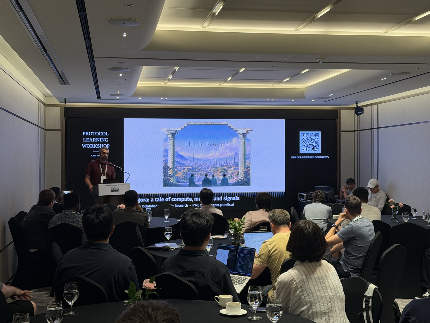 A speaker addressing attendees at the Protocol Learning workshop