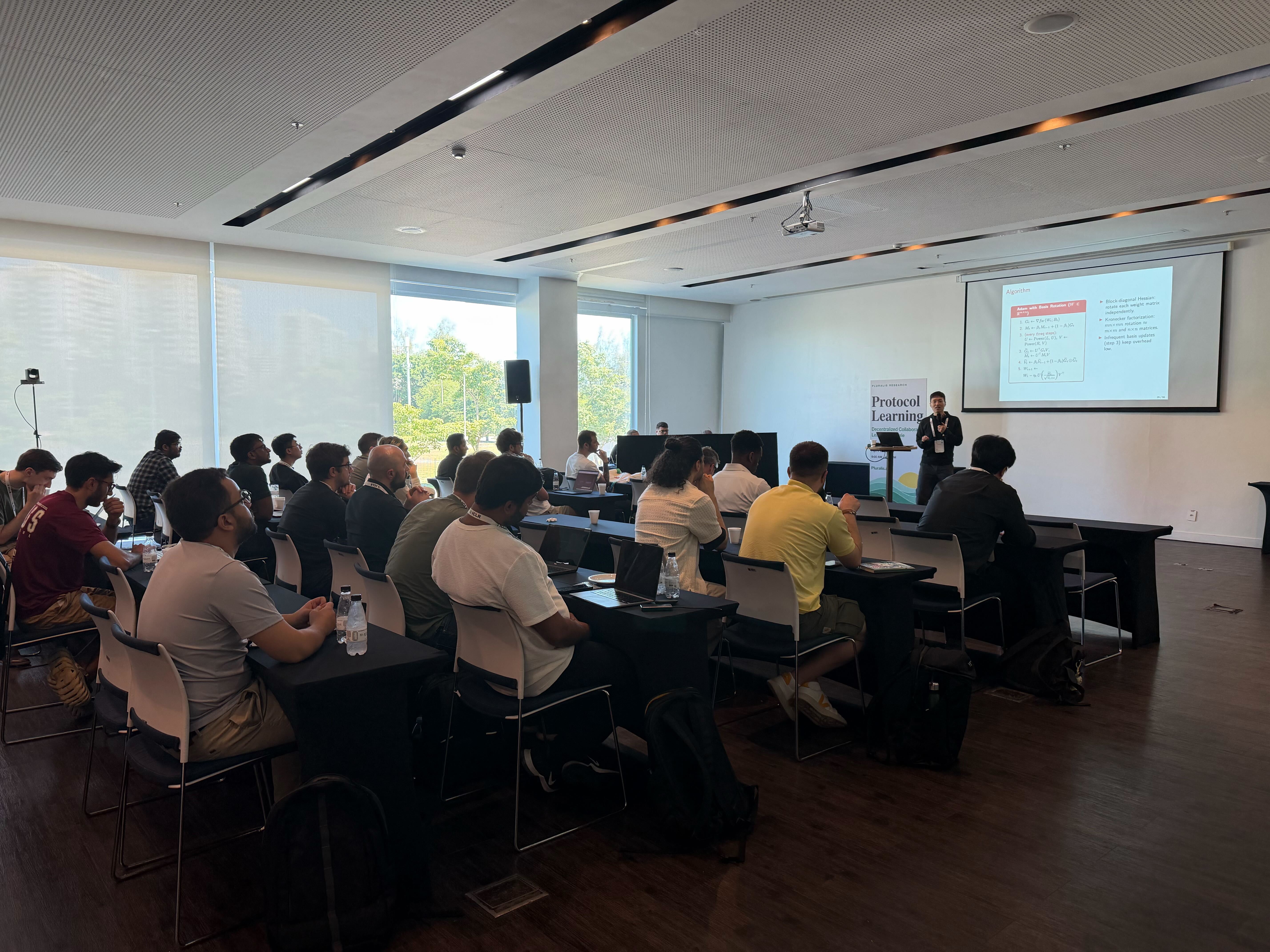 Attendees watching a Protocol Learning workshop presentation in Rio de Janeiro