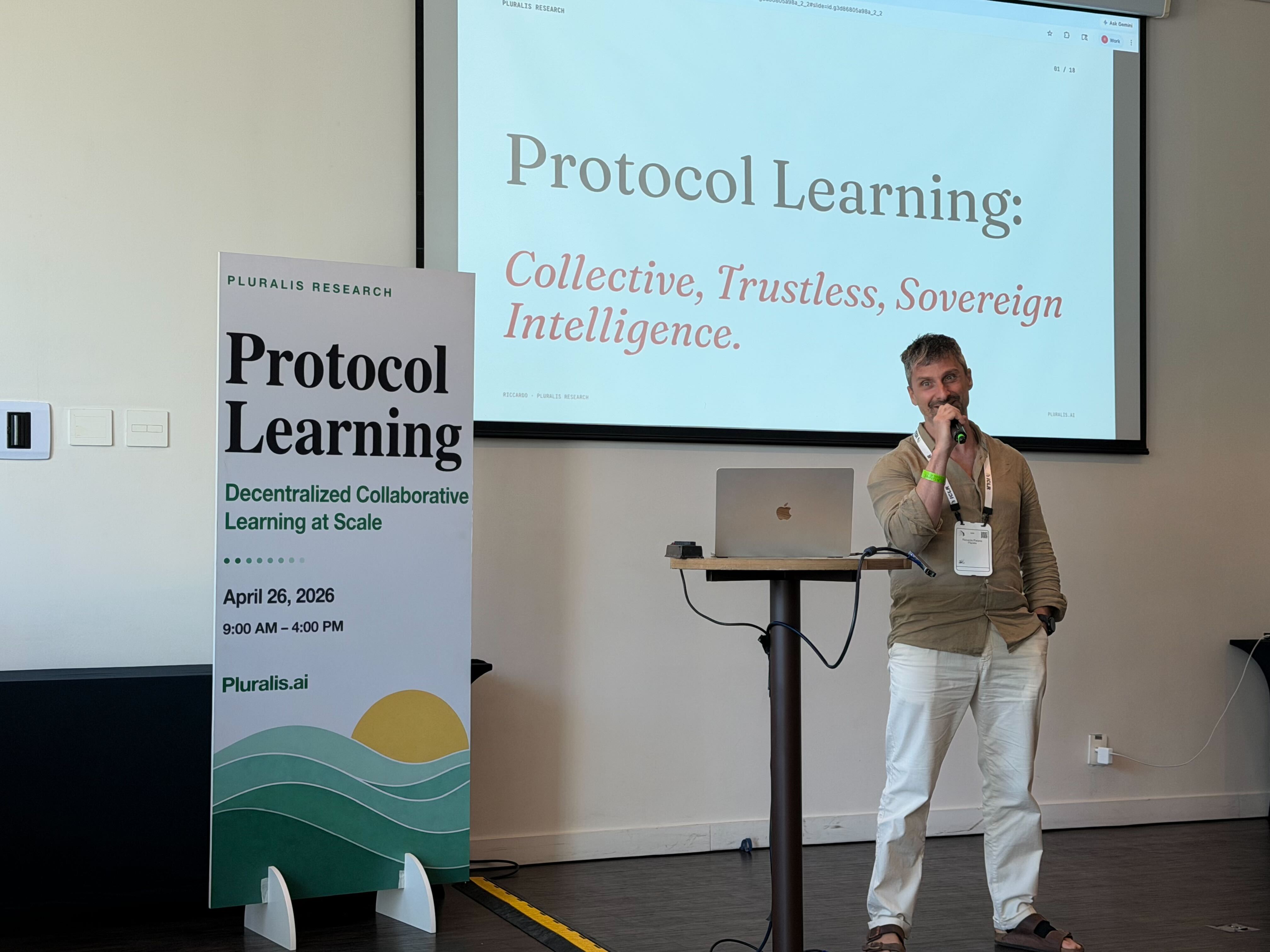 Speaker presenting at the Protocol Learning workshop beside event signage